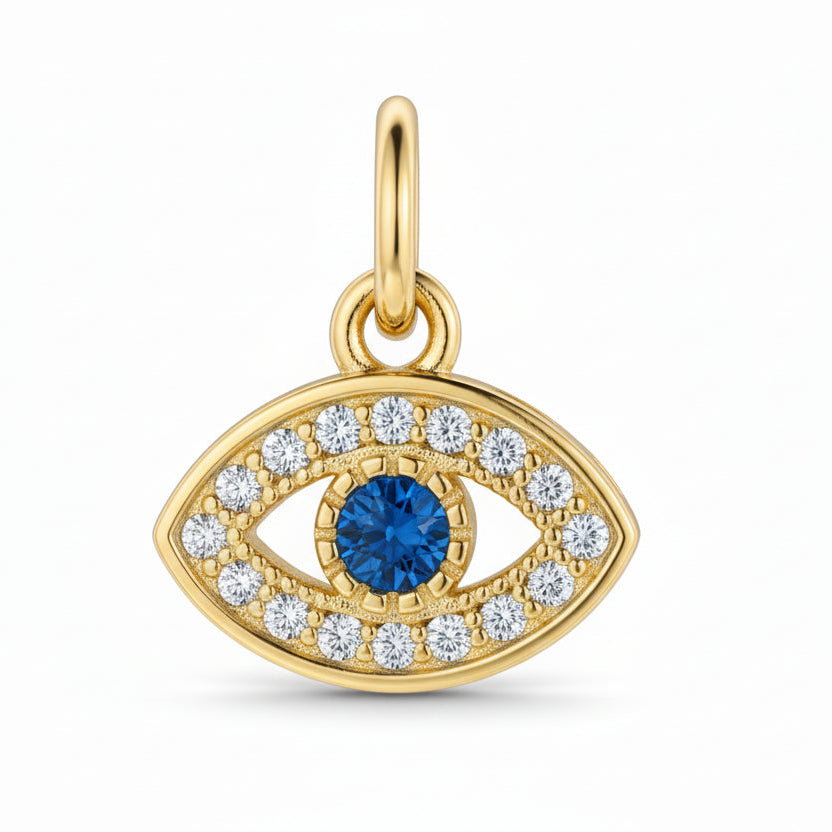 Gold evil eye pendant with blue gemstone and cubic zirconia on a white background